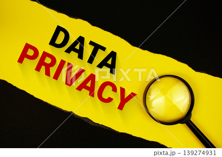 Data Privacy text on yellow with black paper torn ripped and magnifying glass Data Privacy text on yellow with black paper torn ripped and magnifying glass 139274931