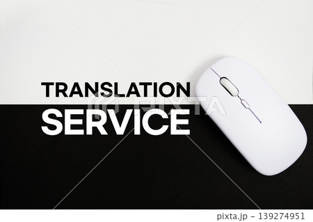 Translation Services text and wireless mouse on white and black background Translation Services text and wireless mouse on white and black background 139274951