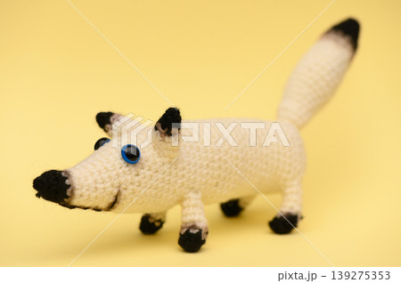 Handmade Knitted White Dog on Yellow Background 139275353
