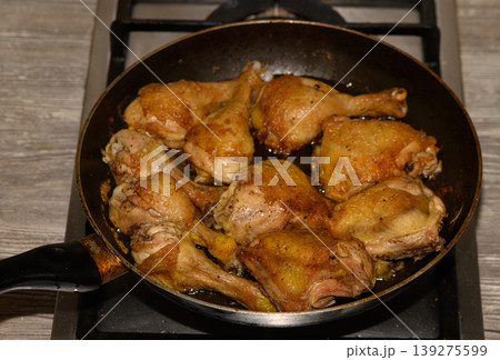 Pan Fried Chicken Drumsticks and Thighs in Skillet Isolated on White Background Pan Fried Chicken Drumsticks and Thighs in Skillet Isolated on White Background 139275599