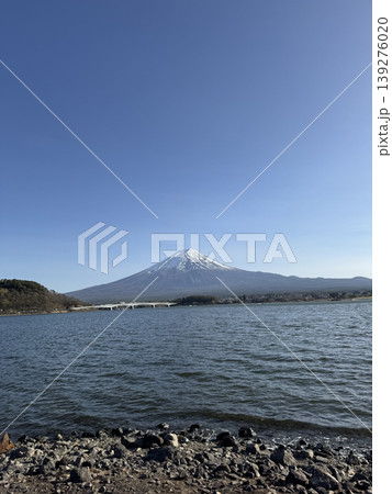 Snow capped Fuji mountain lake blue sky water shoreline rocky shore landscape nature scenic view Fuji mountain Snow capped Fuji mountain lake blue sky water shoreline rocky shore landscape nature scenic view Fuji mountain 139276020