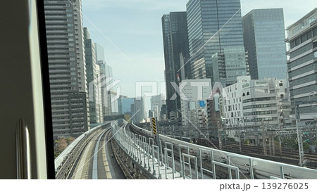 Elevated train track city skyline urban railway view modern building travel motion daylight Elevated train track city skyline urban railway view modern building travel motion daylight 139276025