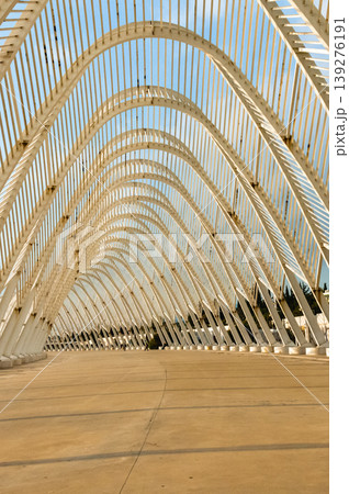Symmetrical view of Calatrava roof arches at Olympic Complex Athens. Symmetrical view of Calatrava roof arches at Olympic Complex Athens. 139276191