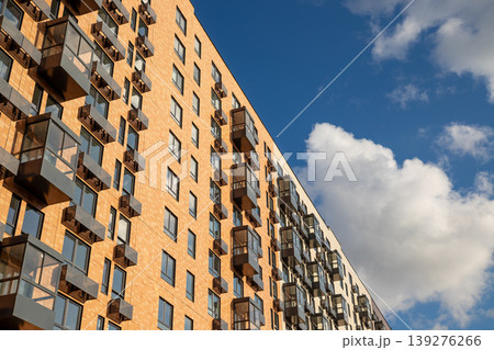 Modern residential building with many windows, air conditioner boxes. Urban architecture and real estate development. Contemporary renovation apartment complex. Modern residential building with many windows, air conditioner boxes. Urban architecture and real estate development. Contemporary renovation apartment complex. 139276266