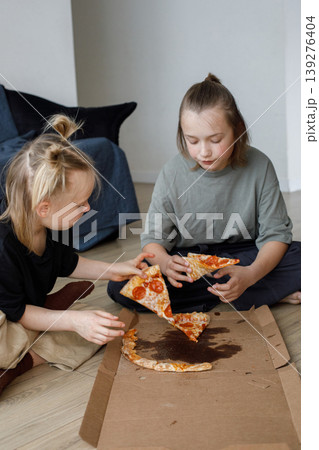 Young kids sibling eating pizza at home. Little girl and boy children portrait 139276404