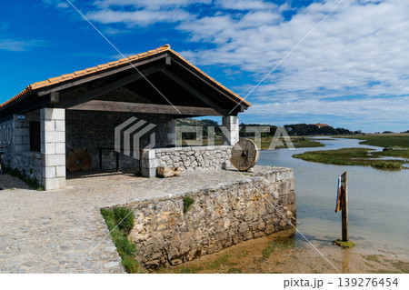 Scenic view of a stone tide mill in the Wetlands of Joyel, Cantabria, Spain Scenic view of a stone tide mill in the Wetlands of Joyel, Cantabria, Spain 139276454