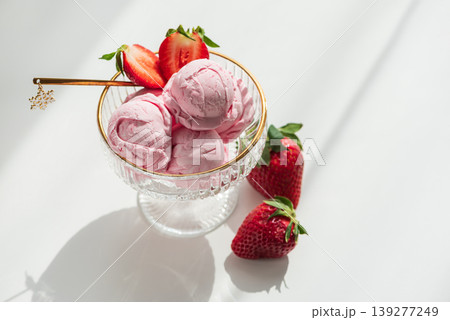 Strawberry Ice Cream with Fresh Strawberries on White Table Strawberry Ice Cream with Fresh Strawberries on White Table 139277249