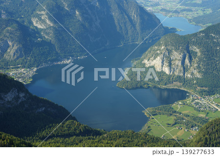 Impressive view of an alpine valley with a lake from the top of a mountain 139277633
