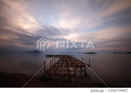 Old abandoned wooden fishing pier on the sea in the countryside 139279407