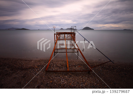 Old abandoned wooden fishing pier on the sea in the countryside Old abandoned wooden fishing pier on the sea in the countryside 139279687