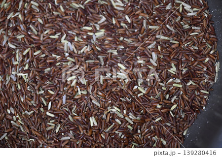 Organic brown rice raw grain healthy food closeup texture uncooked cereal natural ingredient vegan diet agriculture harvest Organic brown rice raw grain healthy food closeup texture uncooked cereal natural ingredient vegan diet agriculture harvest 139280416