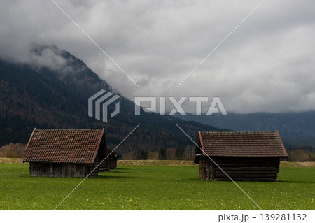 Misty Bavarian Alpine Huts in Green Meadow Misty Bavarian Alpine Huts in Green Meadow 139281132