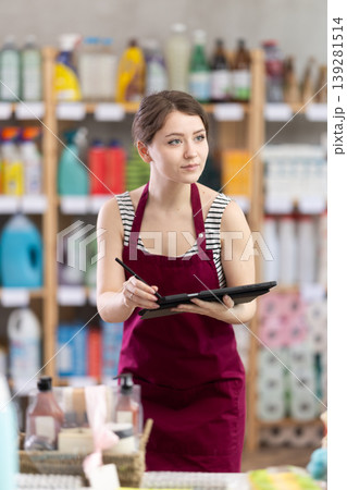 woman takes inventory using a tablet 139281514