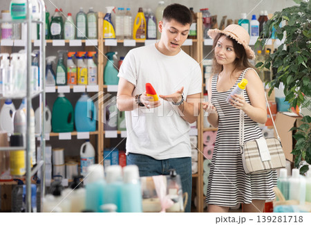 Couple chooses an insect repellent Couple chooses an insect repellent 139281718