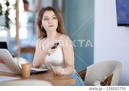 Female manager starts presentation demonstration using remote control Female manager starts presentation demonstration using remote control 139281730
