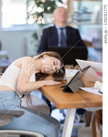 Office employees rest during a break at work. 139281775