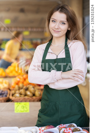 Female salesman standing in grocery store Female salesman standing in grocery store 139281824