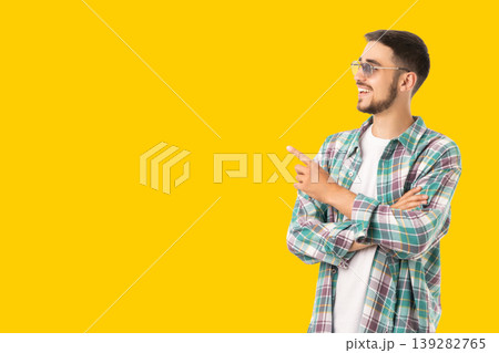 Person gestures happily with arms crossed on bright background 139282765