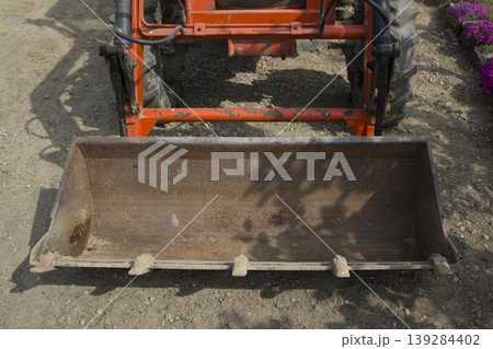 A close-up of the tractor's bucket. A close-up of the tractor's bucket. 139284402