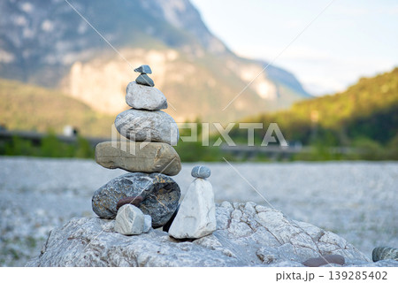 Balanced stone tower in mountain valley Balanced stone tower in mountain valley 139285402