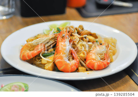 dry prawn noodles or stir fried noodles or pad thai , noodles without soup or Thai food or dry noodles or prawn noodles 139285504