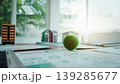 Real estate planning desk with miniature houses and market charts 139285677