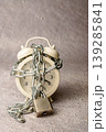 Alarm clock chained and locked, symbolizing limited time 139285841