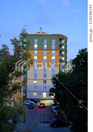 An apartment building in Ukraine features bright lights shining through its windows An apartment building in Ukraine features bright lights shining through its windows 139286243