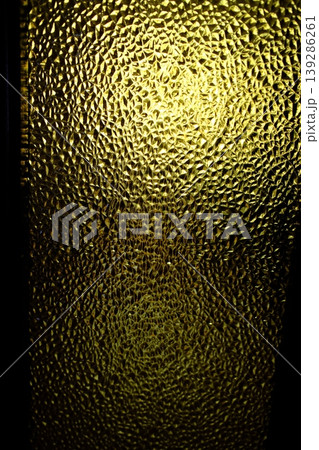 Glass panel reflects light creating abstract patterns with small triangles Glass panel reflects light creating abstract patterns with small triangles 139286261