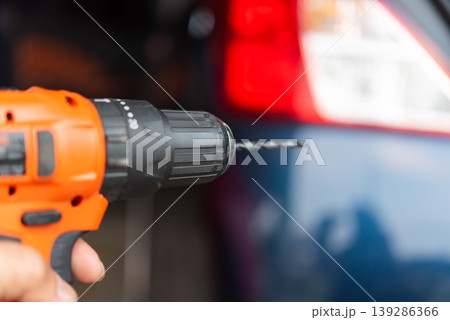 Close up of cordless drill with metal bit ready for drilling repair and construction tool for home improvement maintenance and DIY work 139286366