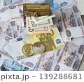 Bitcoin, a chest of dollars, and a euro banknote in Russian rubles. 139288681
