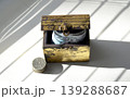 A wooden chest containing coins and Russian rubles. 139288687