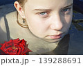 a beautiful girl bathes in a phyto barrel or bath with rose and lily petals 139288691
