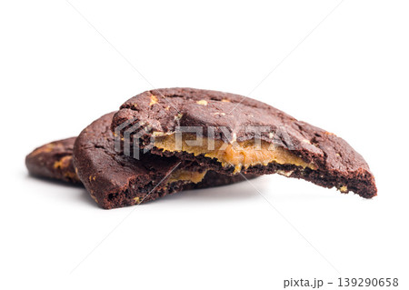 Chocolate Cookies With Caramel Filling Stacked and Broken Bite on White Background 139290658