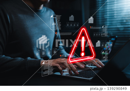 Data security warning and cyber risk alert concept. Person using laptop with digital files, lock icon, red warning symbol. data breach, document protection, threat detection, secure incident response 139290849