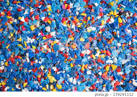 Plastic colorful pieces recycling shredded for industrial use. Plastic colorful pieces recycling shredded for industrial use. 139291112