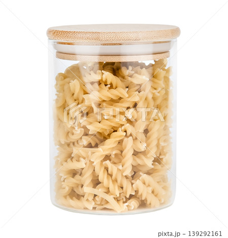Pasta in a glass jar with a wooden lid isolated on white background Pasta in a glass jar with a wooden lid isolated on white background 139292161