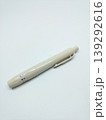Top view of a beige lancing device pen isolated on a white background 139292616