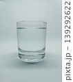 Front view of a clear glass filled with water isolated on a plain white background 139292622