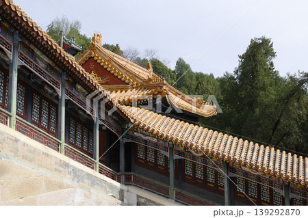 Curved wooden roofs of ancient Buddhist Foxiange Temple in Yiheyuan Park in Beijing, China Curved wooden roofs of ancient Buddhist Foxiange Temple in Yiheyuan Park in Beijing, China 139292870