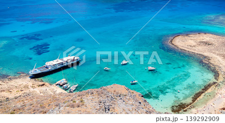 Sailboats anchored near a stunning turquoise beach Sailboats anchored near a stunning turquoise beach 139292909