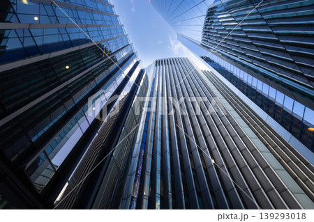 Looking up at tall corporate buildings in financial district 139293018