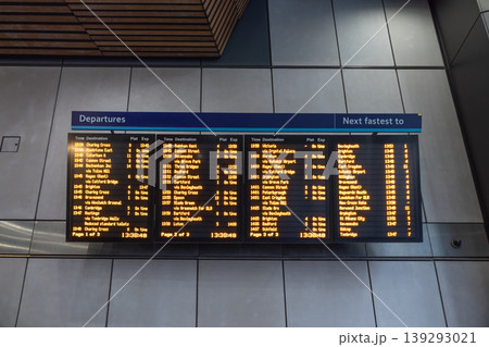 Train station departure board with orange led text Train station departure board with orange led text 139293021
