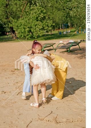 Funny kids hug, have fun playing together in the park. World Children's Day. 139293654