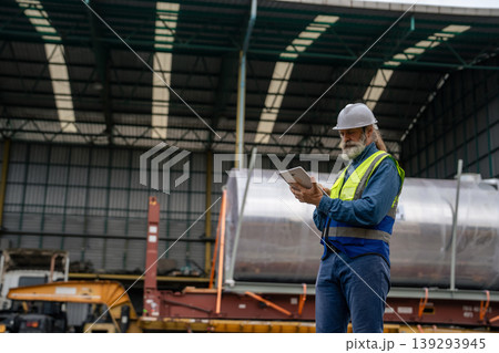 Engineers Inspect Cargo Shipment at Container Yard, Logistics Concept. Engineers Inspect Cargo Shipment at Container Yard, Logistics Concept. 139293945