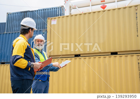 Engineers Inspect Cargo Shipment at Container Yard, Logistics Concept. Engineers Inspect Cargo Shipment at Container Yard, Logistics Concept. 139293950