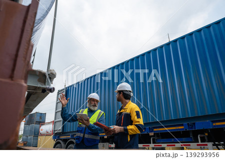 Engineers Inspect Cargo Shipment at Container Yard, Logistics Concept. Engineers Inspect Cargo Shipment at Container Yard, Logistics Concept. 139293956