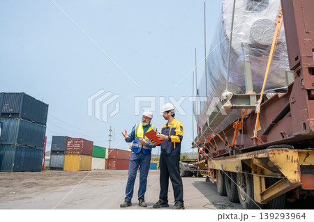 Engineers Inspect Cargo Shipment at Container Yard, Logistics Concept. Engineers Inspect Cargo Shipment at Container Yard, Logistics Concept. 139293964