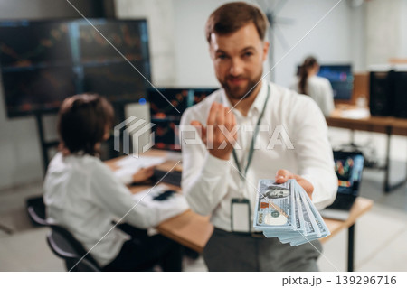 Profit, holding money. Business people are working with stock market exchange in office 139296716
