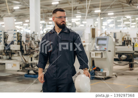 Many of the professional equipment and materials for windows making. Warehouse worker in an industrial environment of a factory or storage area Many of the professional equipment and materials for windows making. Warehouse worker in an industrial environment of a factory or storage area 139297368